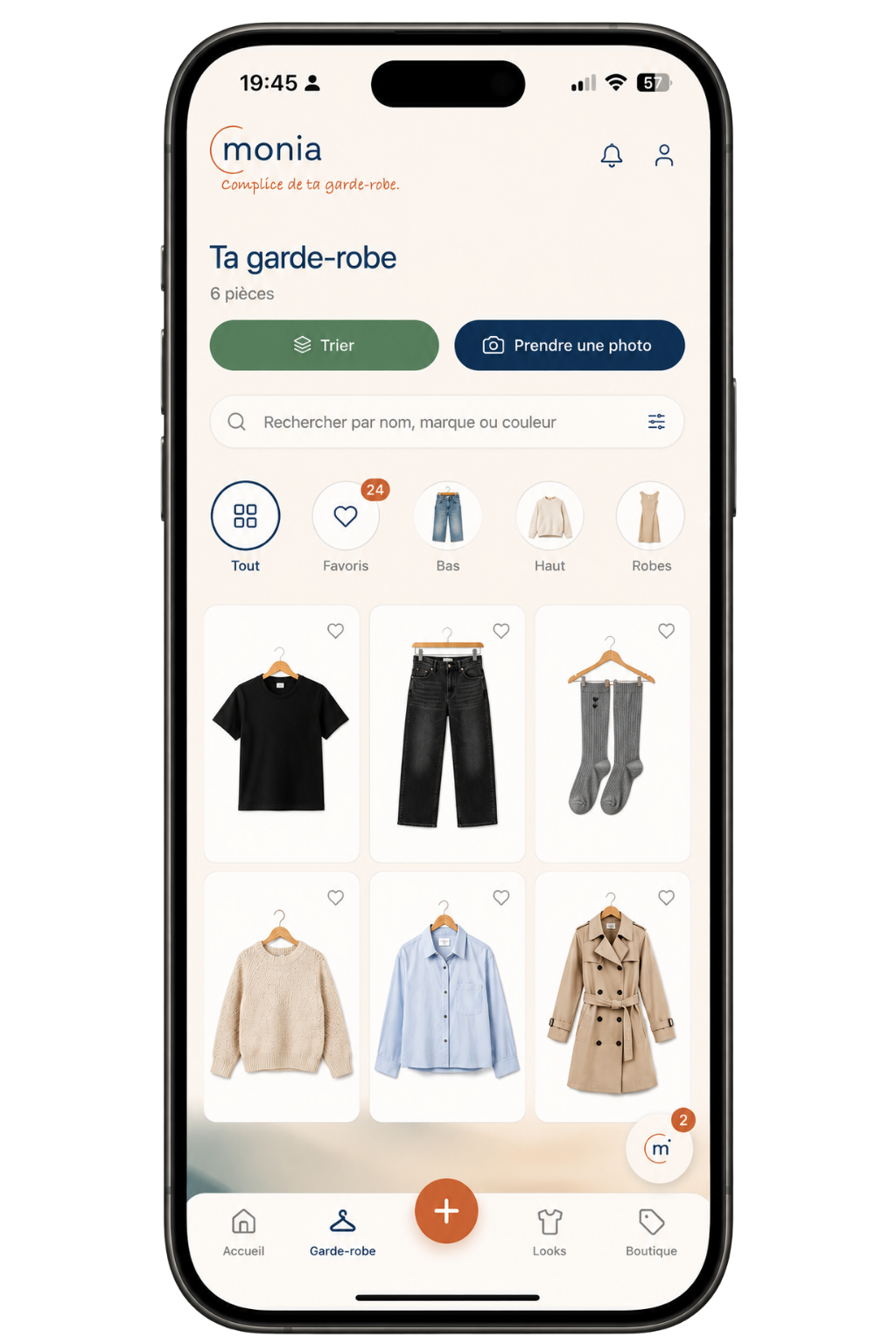monia wardrobe screen — grid of digitized clothes